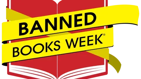 red book with yellow tape across with the words banned books week