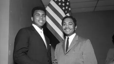 Mervyn Dymally (right) meets Muhammad Ali (left) at a Compton NAACP meeting in 1966.