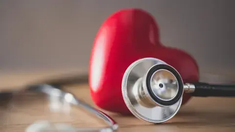 heart next to a stethoscope