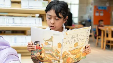 kid reading book