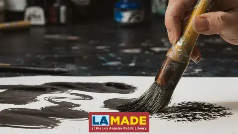 hand painting ink with a brush