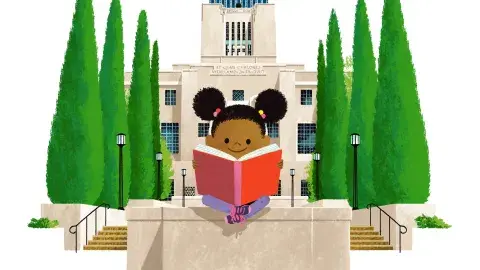 A child reads a book in the garden with the Central Library behind them.