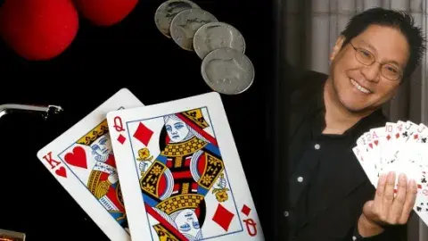 Magic show props alongside magician "Magic Wayne" holding a fanned deck of face cards.