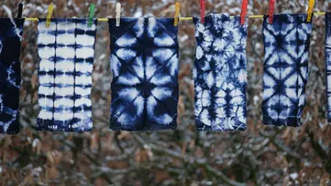 shibori samples hanging on a line