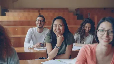 Students in a classroom listening to a leacture.