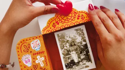hands making an ofrenda 