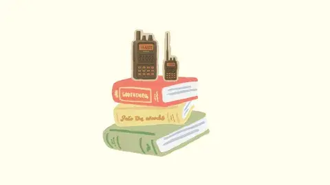 Handheld black HAM radios with orange lit screens sit on top a stack of fiction books.