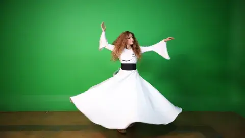 Person in motion doing the Whirling Dance.