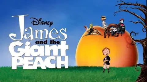 James in front of a giant peach