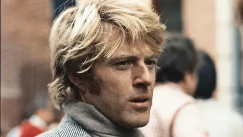 man with grey sweater