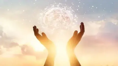 Hands reaching to the sky