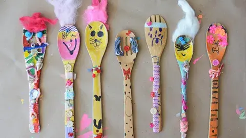 colorfully decorated wooden spoon puppets