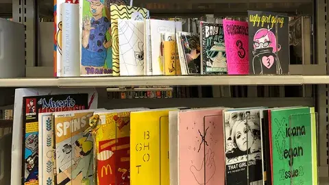 colorful drawing of the word ZINES