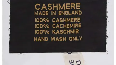 clothing label that reads: CASHMERE Made in England, 100% Cashmere