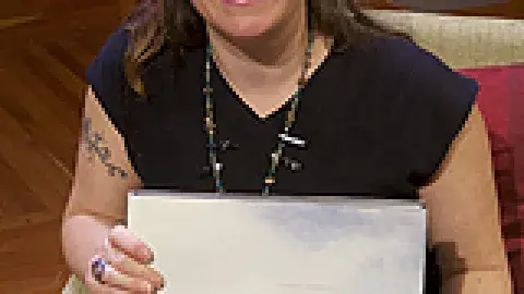 Rachel Sussman holding onto a book