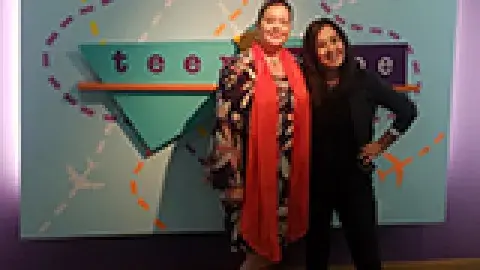 2 therapists writers in front of teenscape sign