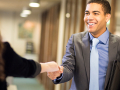 man shaking a hand of another business person after an interview