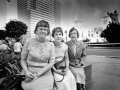 Three librarians are pictured in front of the burning Central Library 