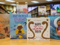 Four children's books displayed on a table