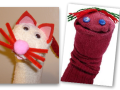 White sock puppet with pointy ears and whiskers and red sock with button eyes and yarn hair