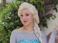 Female with blonde wig and blue princess dress