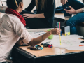 teenage students sitting around a table