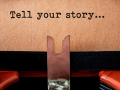 typewriter with page that says tell your story...