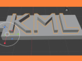Graphic of the 3d model of keychain with the text KML on it, in Blender