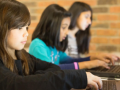 Young students working on laptops