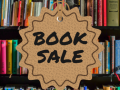 a bookshelf with the text "Book Sale" in the center