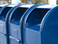 Four blue mailboxes