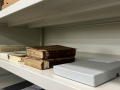 Library shelves with rare books and an example of a clamshell box