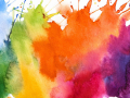 Splattered paint of every color of the rainbow. 