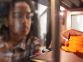 girl grabbing a 3D printed object