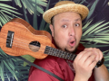 Josue Martinez wearing a hat and holding a ukelele