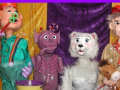 Four marionettes, l to r: red-hatted white human-type in green with bubble wand, purple alien, white furry bear, blonde white human-type in tan and red with brown hobby horse