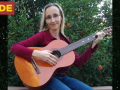 Natalya Grinbaum-Smyrnos playing guitar