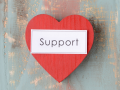 World "Support" on a red heart