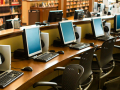 a row of computers in a library