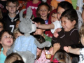 Children watching a puppet show.