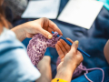Close up of a woman crocheting