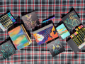 Photos of journals and coloring materials. 