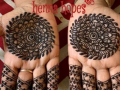 Two hands decorated with henna tattoos