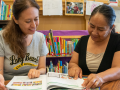 A tutor working with an adult learner