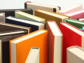 An assortment of hardcover books in standing position