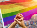 rainbow flag and hands holding