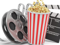 Movie reel with red and white popcorn bucket and clapper board.