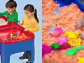 Two children playing at a sand and water table and a pair of small hands grabbing sand.